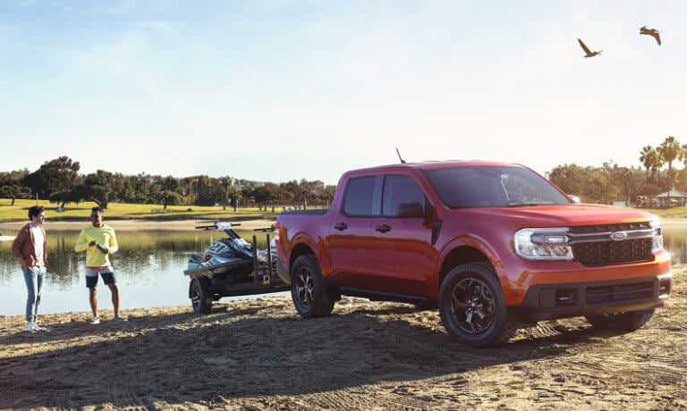 2022 Ford Maverick exterior at waterfront towing boat