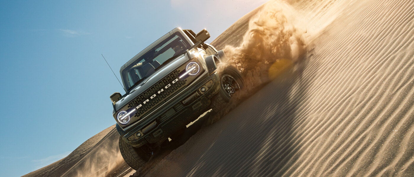 2025 Ford Bronco Heritage Exterior Driving Through Sand Dunes