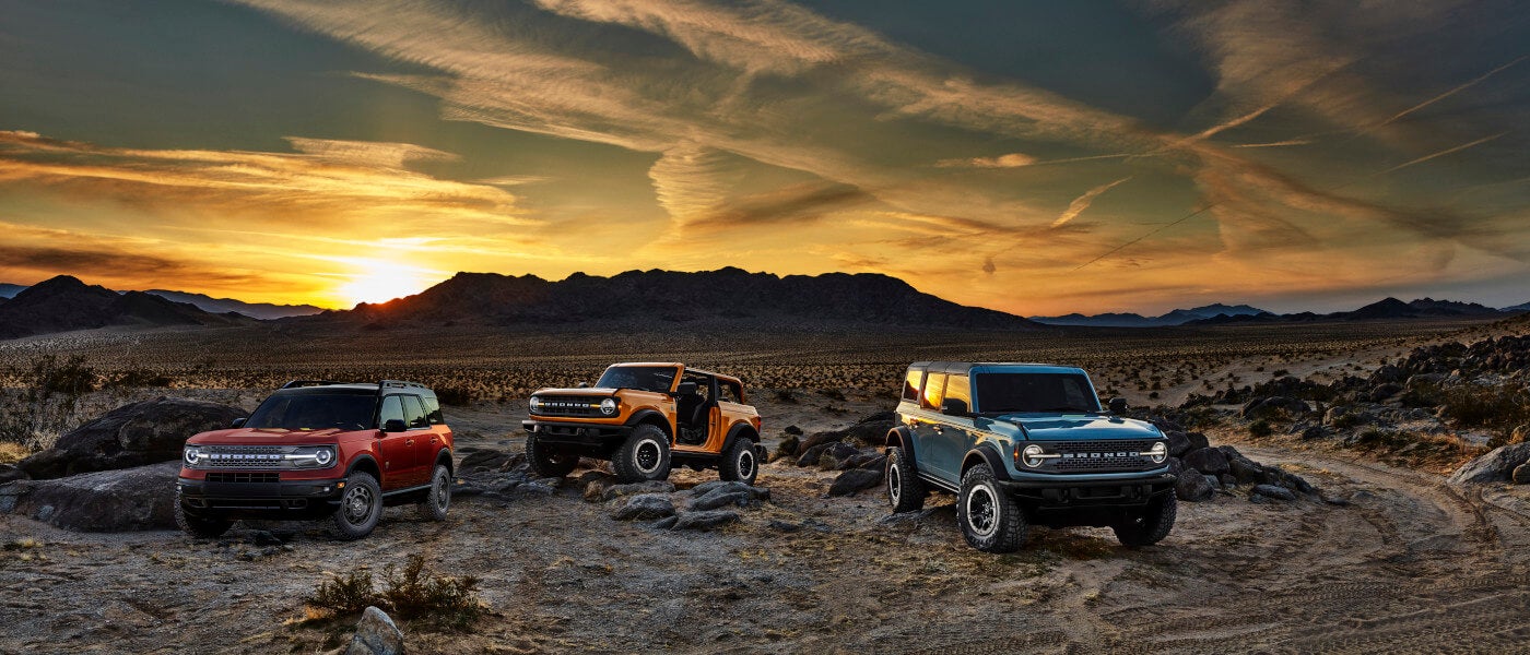 2025 Ford Bronco Exterior Three Parked In Desert At Sunset