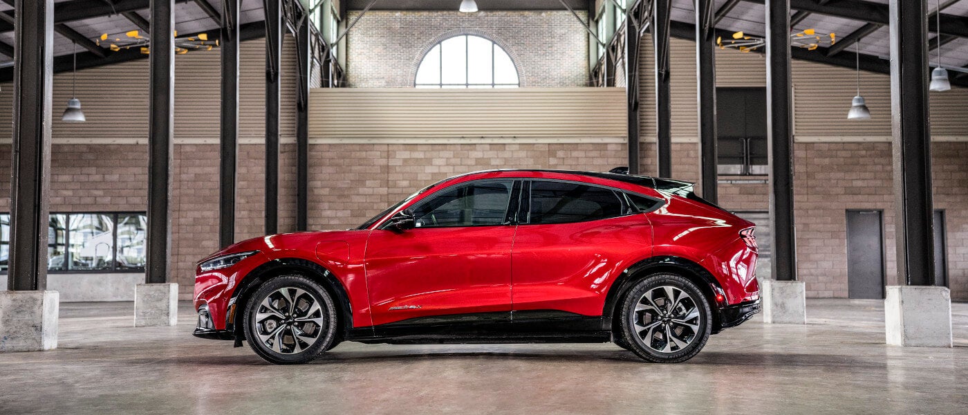 2025 Ford Mustang Mach-E Exterior Side View Parked Under Veranda