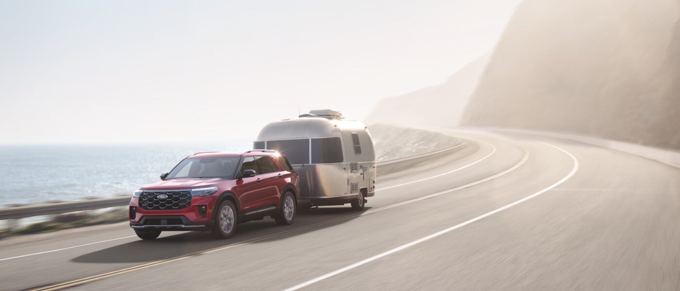 2026 Ford Explorer Exterior Towing Camper On Curved Road