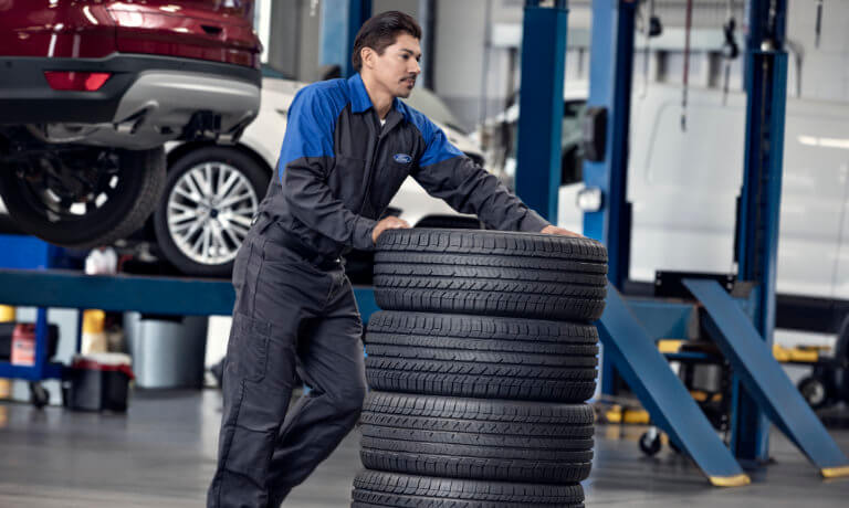 Ford Service Technician With Tires